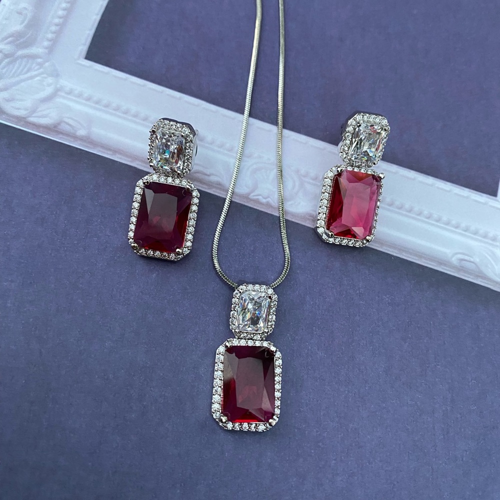 Cz Ad red Swarovski pendant set in silver finish.  3 PC-earrings, pendant chain